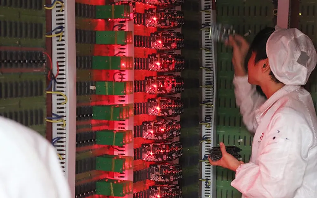 Red lamp test fixture with technician at production