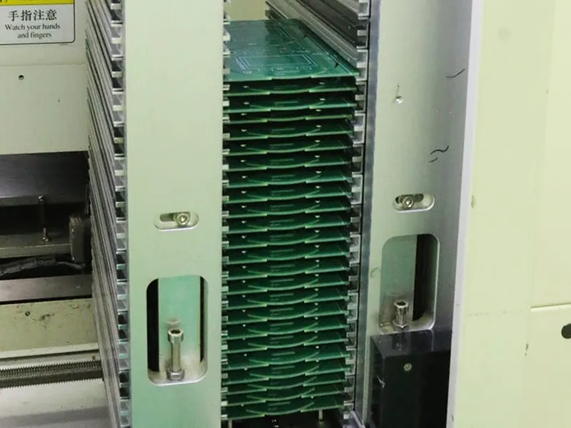 Component storage racks with green PCB reels